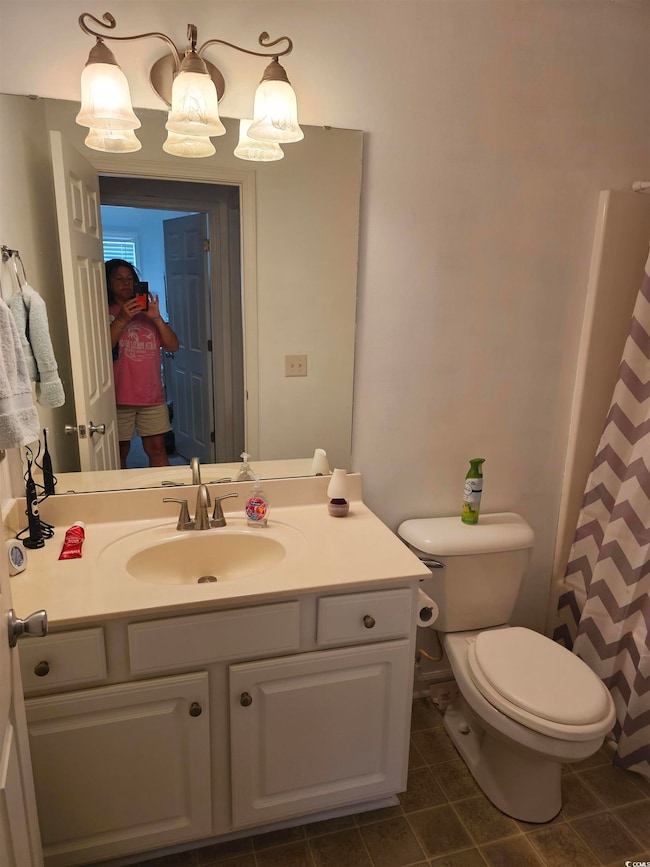 Bathroom featuring tile patterned floors, toilet, 