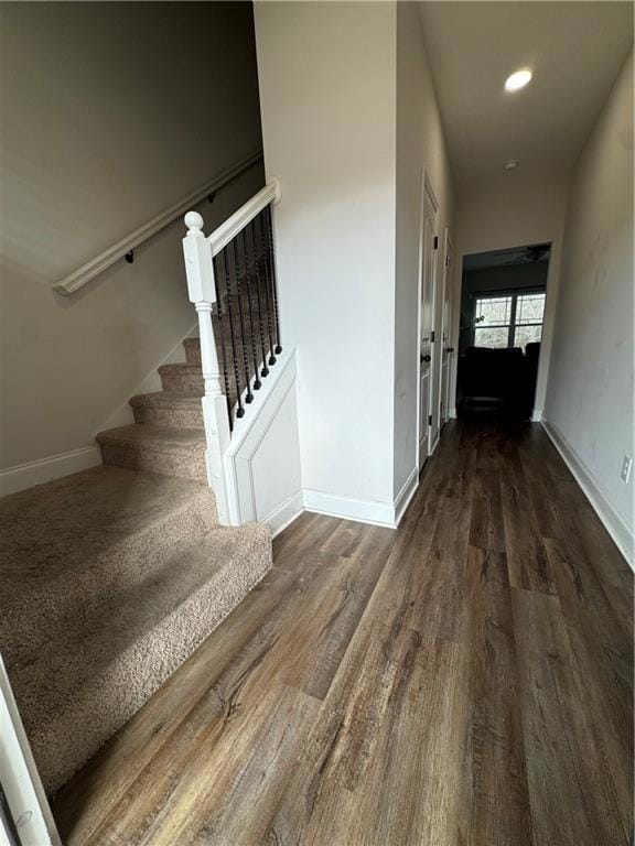 Entrance foyer featuring wood finished floors, stairway, and recessed lighting