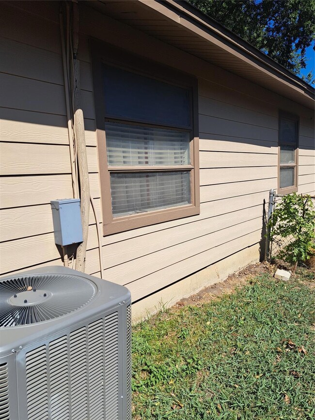 View of property exterior featuring cooling unit