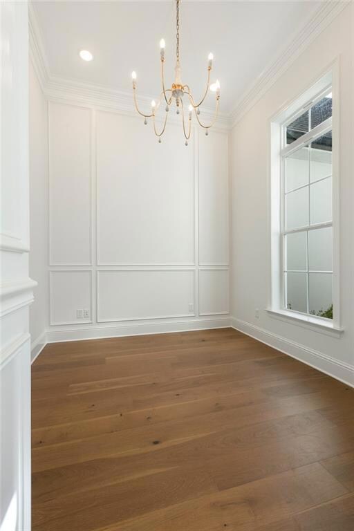 Study with 12' ceiling and custom wainscoting.
