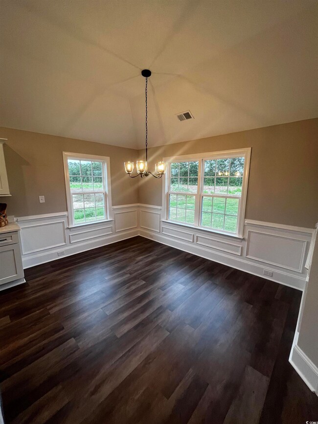 Unfurnished dining area with a chandelier, healthy