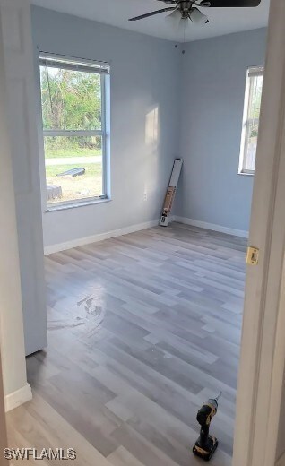 Empty room featuring wood finished floors and ceil