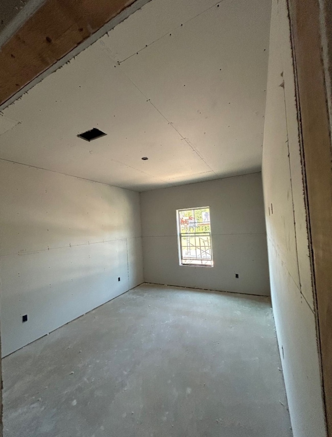 Unfurnished room with concrete floors
