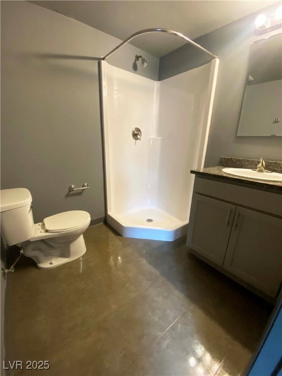 Bathroom featuring a shower stall, toilet, and van