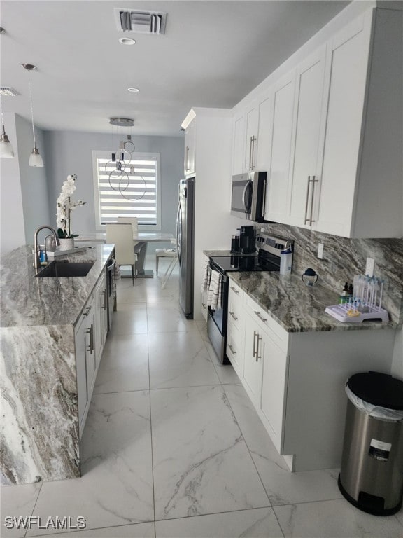 Kitchen with appliances with stainless steel finis