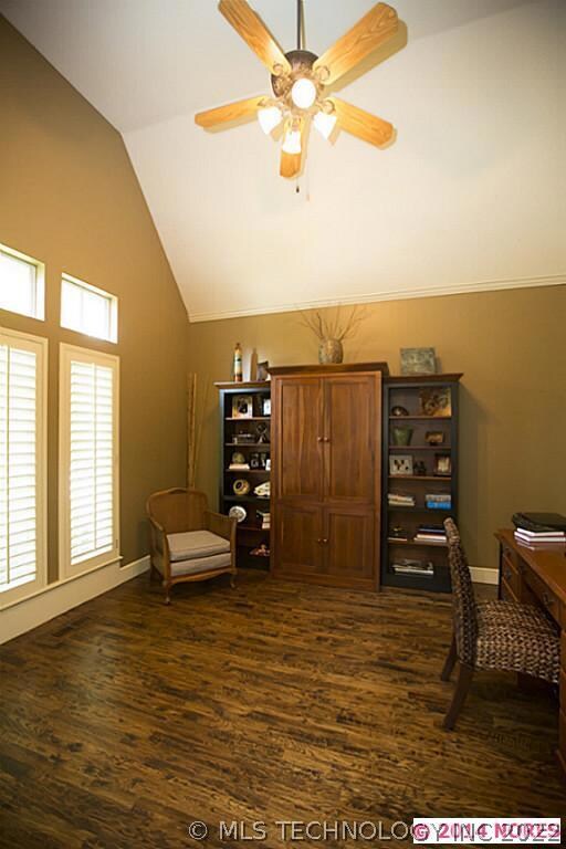 Home Office features a vaulted ceiling, plantation