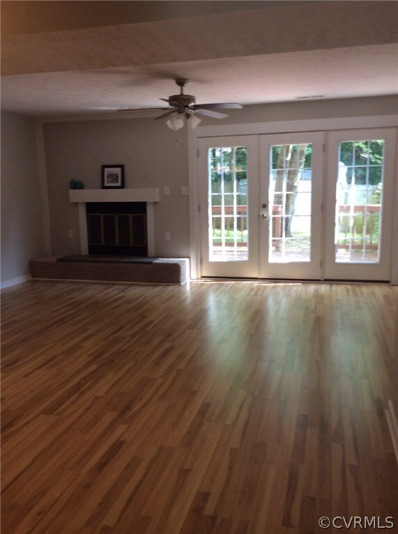 Living room with fireplace and access to private f