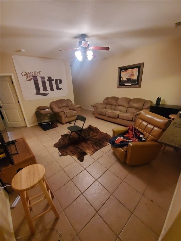 Living area with tile patterned floors and ceiling