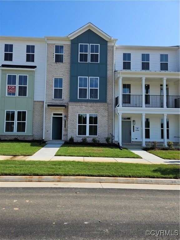 View of front of house featuring brick siding and