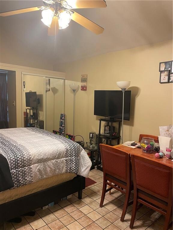 View of the Living/Bedroom...mirrored closets for storage.