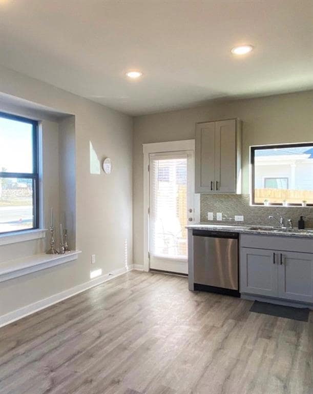 Kitchen with gray cabinets, decorative backsplash