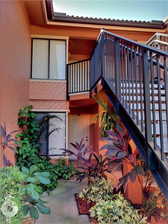 Lovely landscaped entry way leading to first floor
