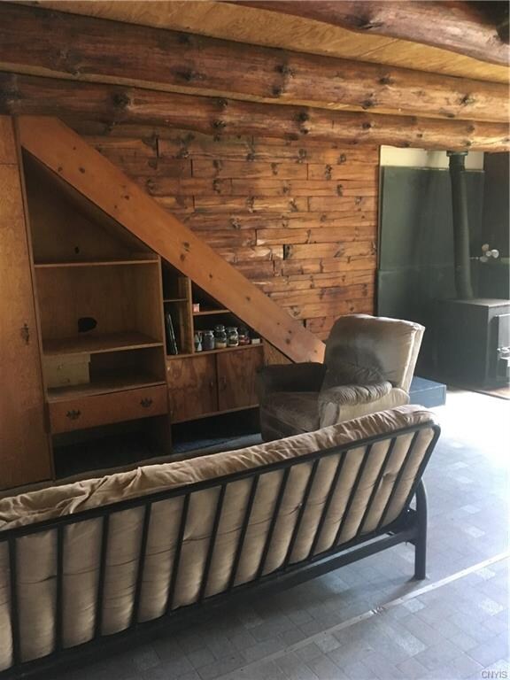 Living area and steps to upstairs.