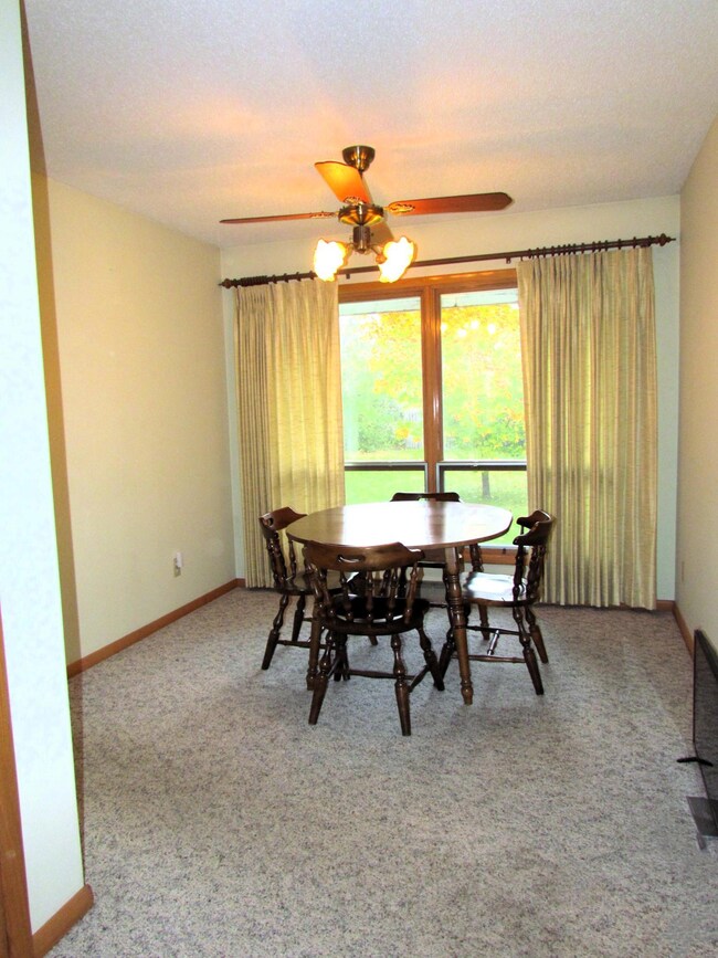 Dining with Large Window to Backyard