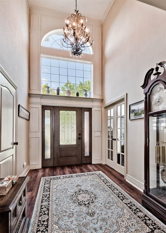 Immerse Yourself in these Luxurious Soaring Ceilings, Arched Windows, French Doors & All the Architectural Details You'd Expect from an Executive Home of this Caliber...