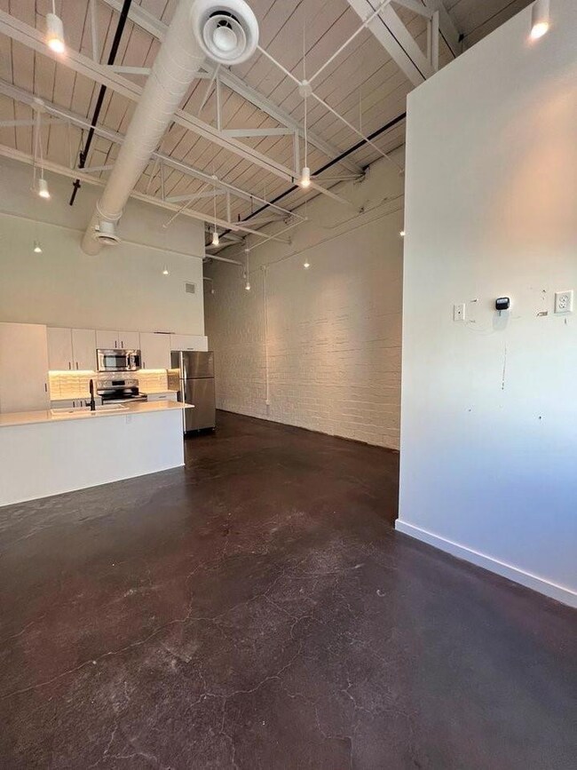 Garage with stainless steel refrigerator