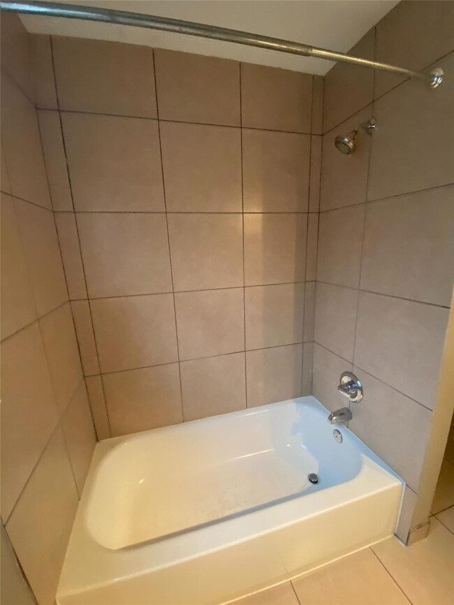 Bathroom featuring shower / bathtub combination