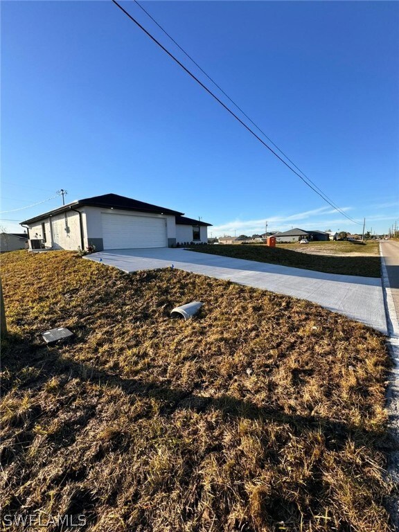 1306 NW Juanita Place, Cape Coral, FL 33993 - photo 2