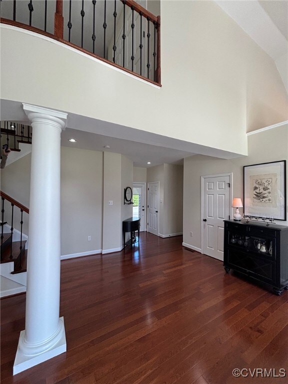 Unfurnished living room with hardwood / wood-style