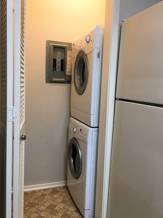 Laundroom in the kitchen with full size washer and