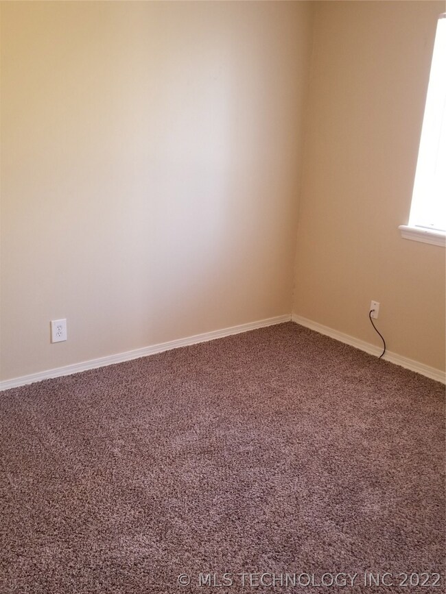 2nd bedroom with new carpet, paint and blinds
