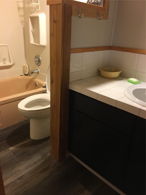 Full bathroom featuring vanity, tasteful backsplas
