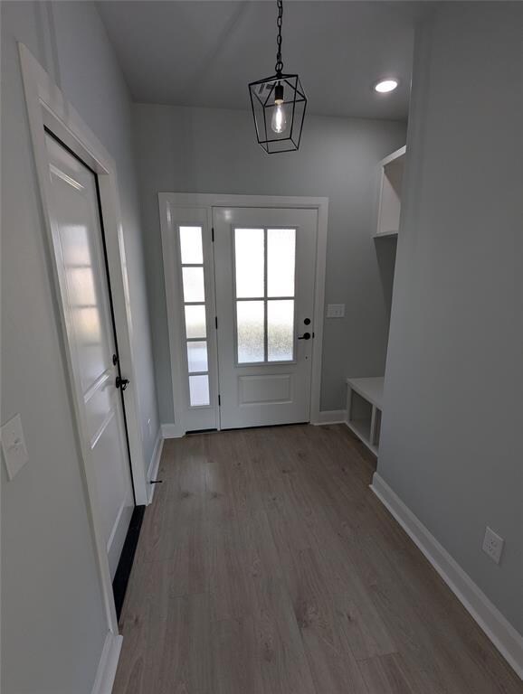 Doorway featuring light hardwood / wood-style floo