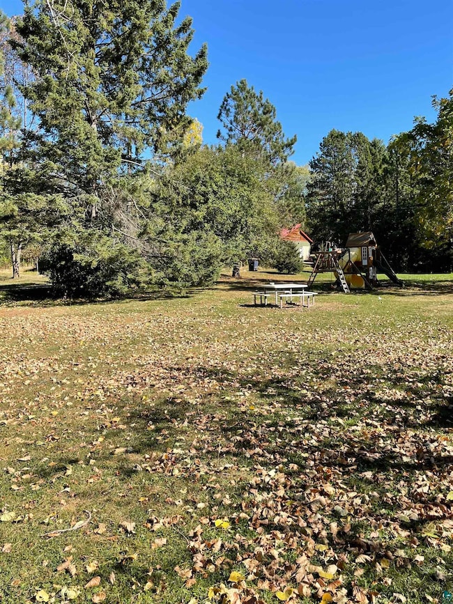 View of yard featuring a playground