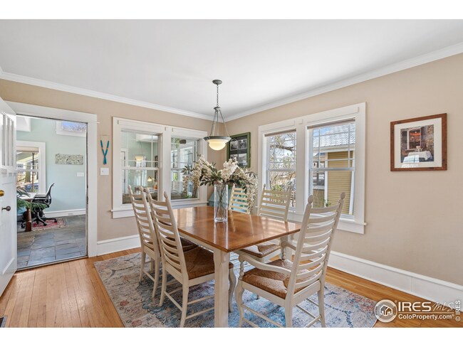 Walk through the sunroom into this large dining space with plenty of room for a table for 8.