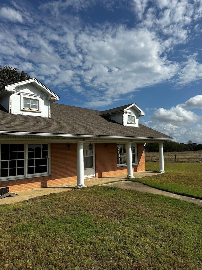 View of front of house featuring a patio and a fro