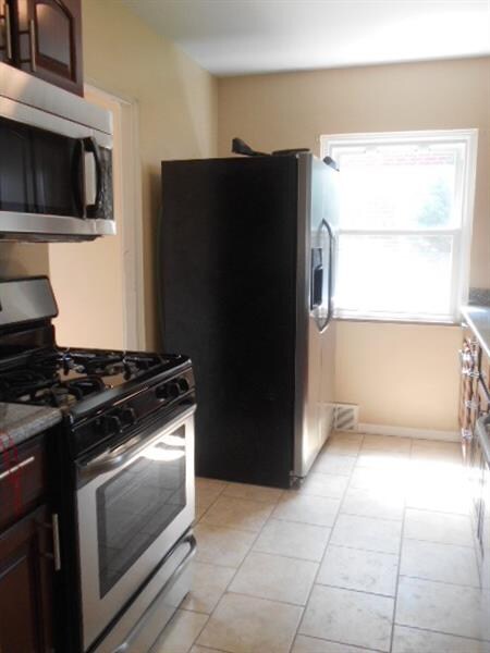 Another view of kitchen with new appliances.
