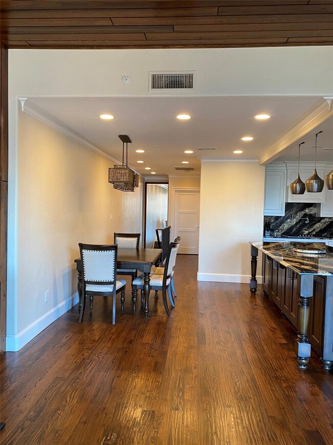 Dining area featuring hand-scraped wood flooring a