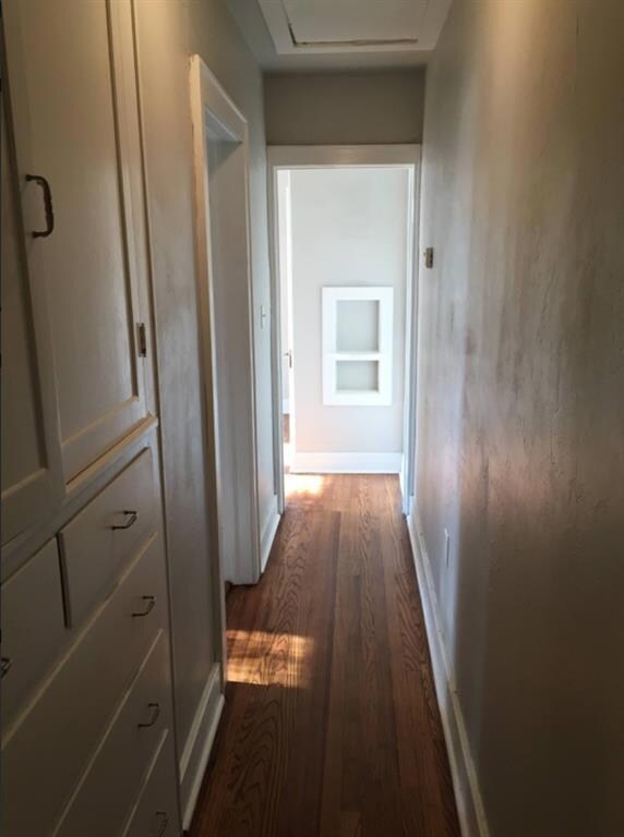 Unit B Hallway featuring dark hardwood / wood-styl