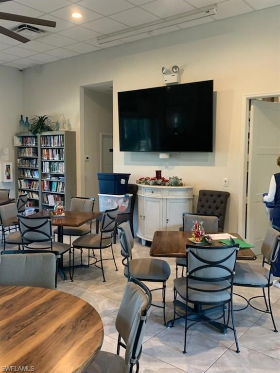 Clubhouse room featuring a drop ceiling and light 