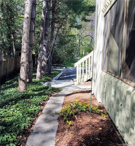 Sidewalk from parking lot to front door & past uni