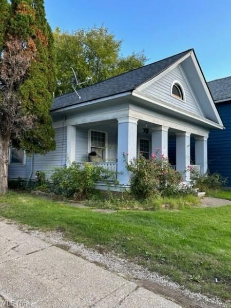 View of front of home featuring covered porch