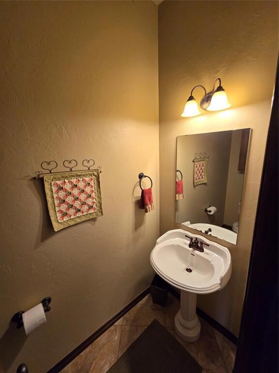 Half Bathroom Guest at front of home with tile flo