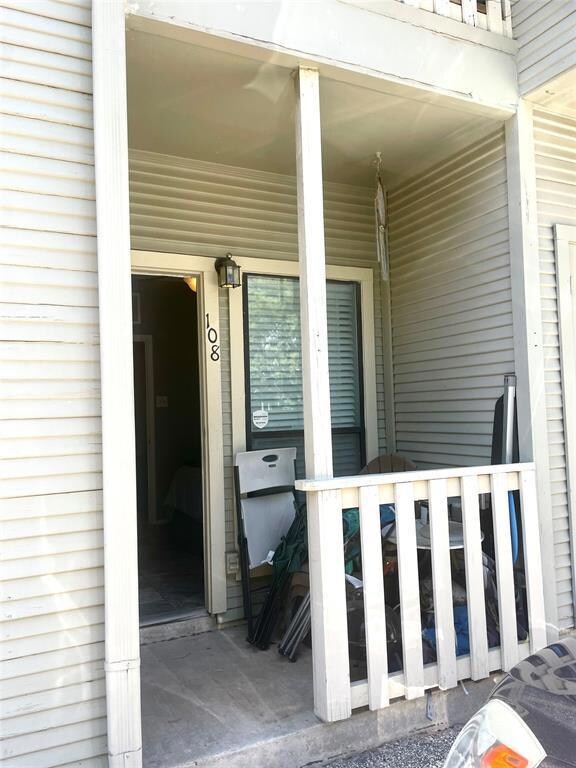 Entrance to property with a porch