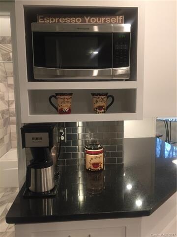 A custom designed microwave cabinet and coffee bar