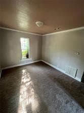Unfurnished room with crown molding and baseboards