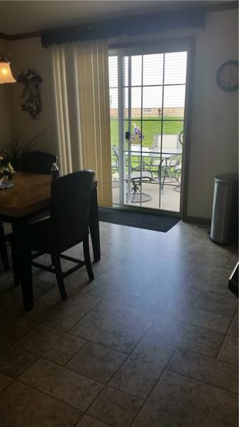Patio adjacent to the eat in kitchen