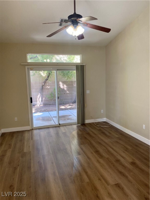 Unfurnished room with dark wood-type flooring and