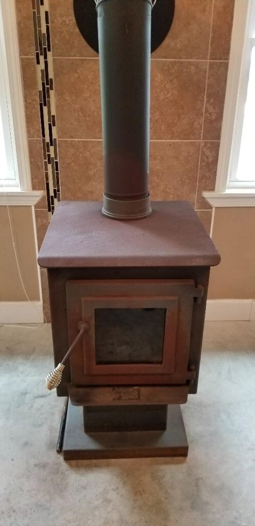 Woodburning stove in sunroom