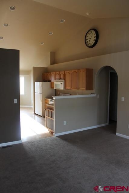 The kitchen overlooks the living area and a nicely