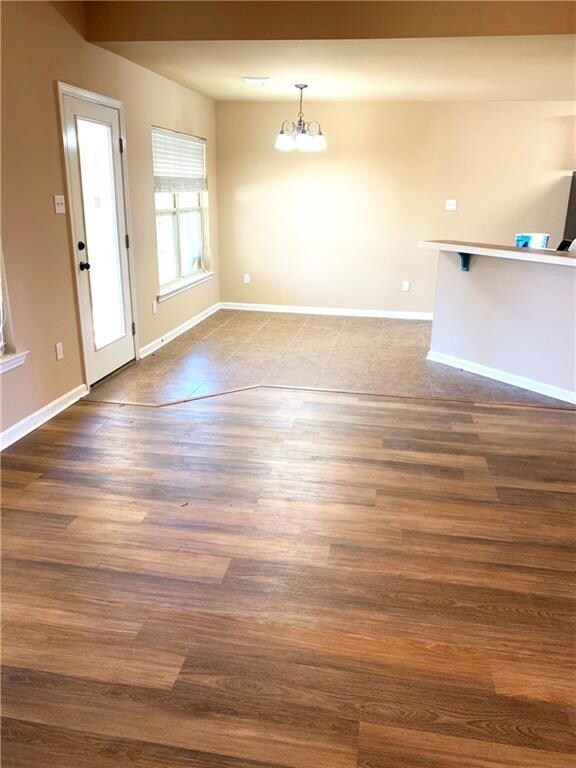 Living area is open to dining and raised bar