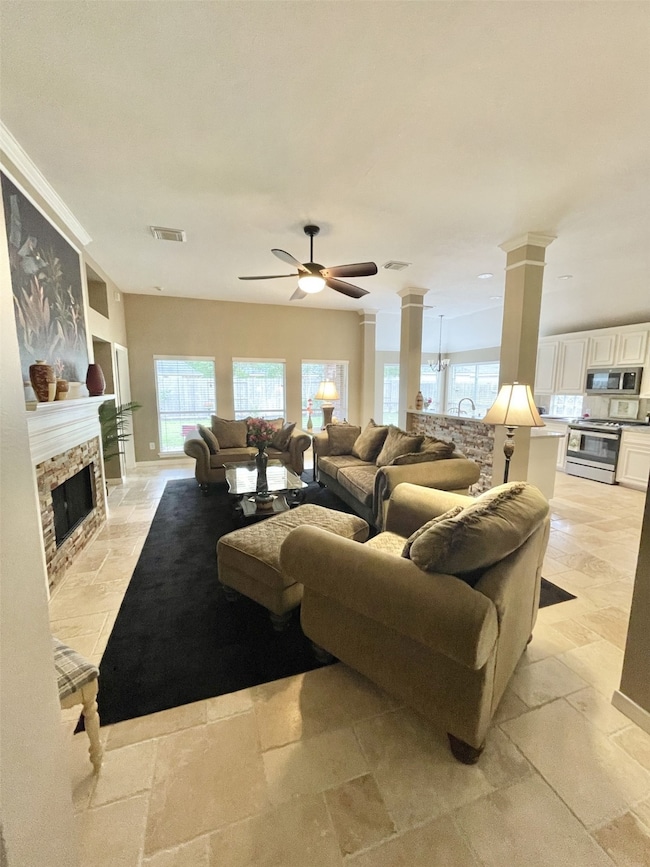 Furnished main living room with fireplace.