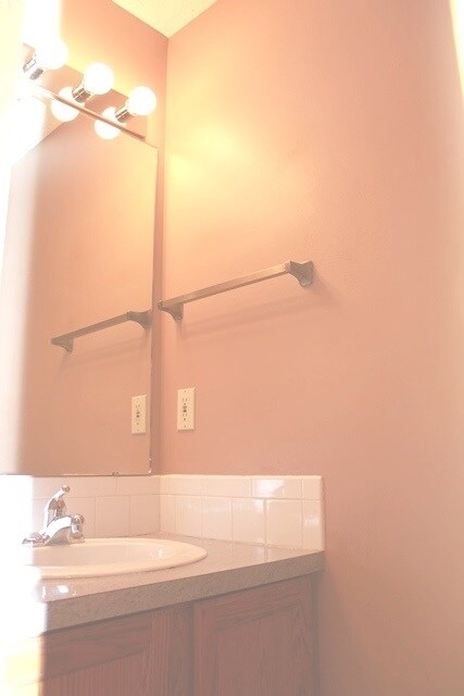 Powder room on main level has new faucet on sink a