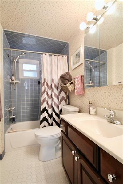 First floor bath has beautiful tile and has been w