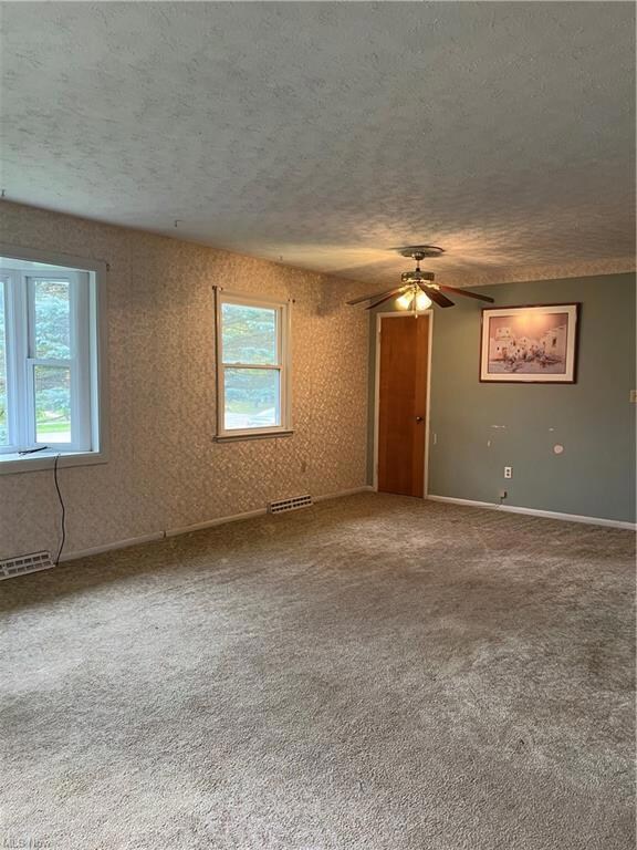 Living room 22 x 16 with carpeting and hardwood fl