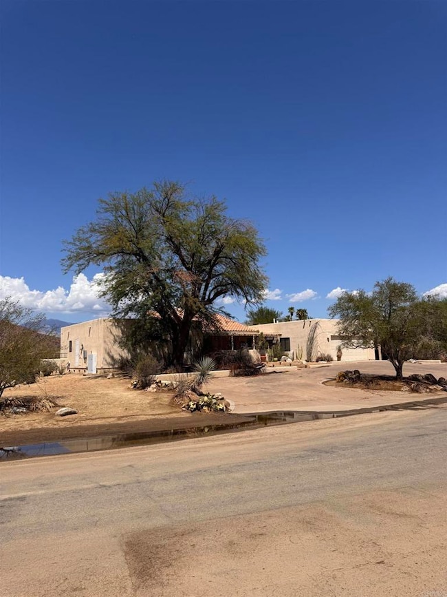 Front exterior with yard on 0.39 acre lot